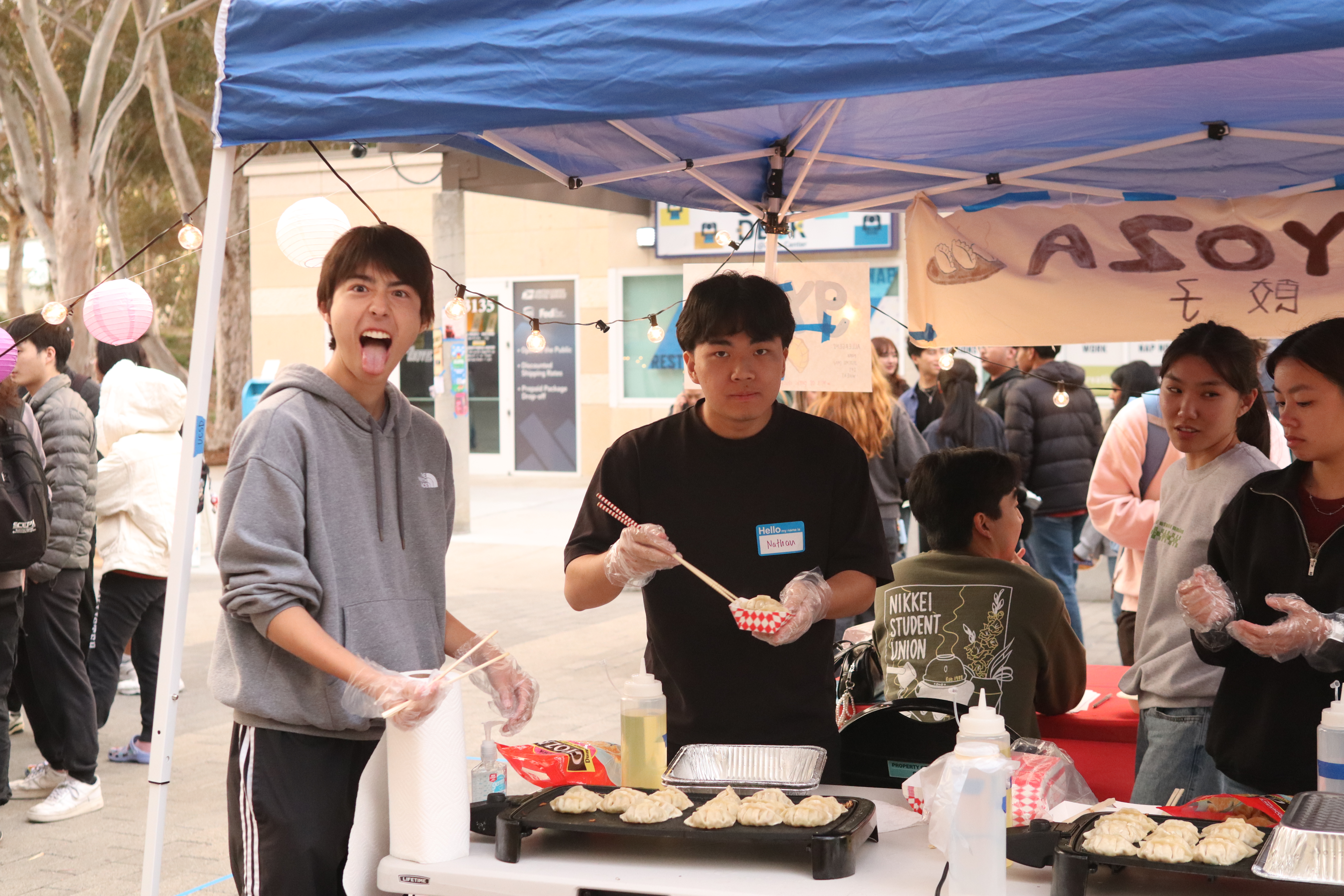 Volunteers cooking gyoza
